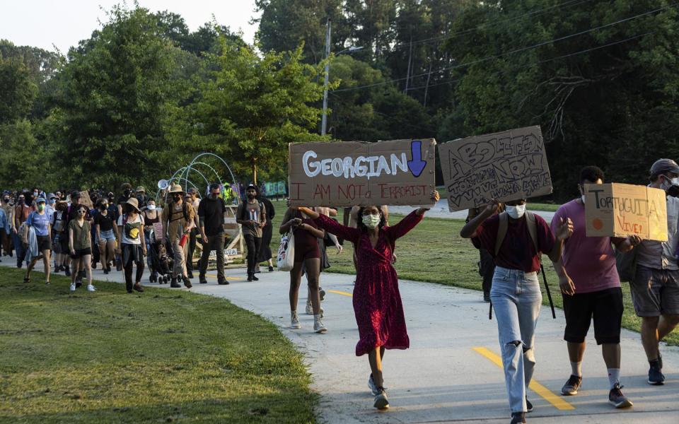 'Stop Cop City protesters march from Atlanta's Gresham Park in honor of slain protester Manuel Teran on June 28, 2023. Photo by Collin Mayfield, SIPA USA.(Sipa via AP Images)