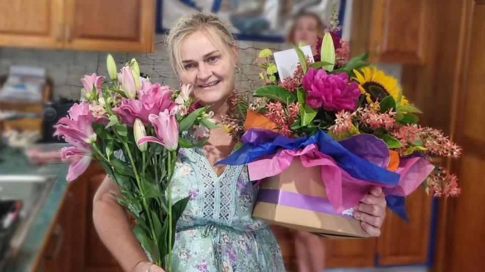 Michelle Wolff holding flowers