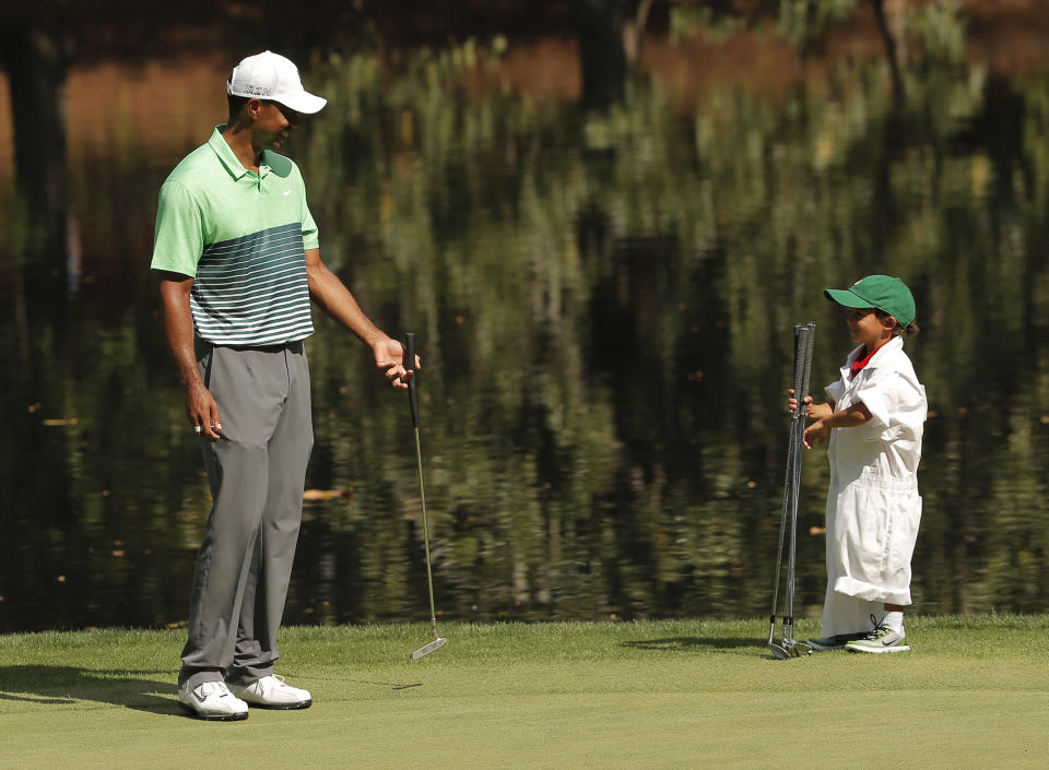 Tiger Woods smiles at his son Charlie at the Augusta National Golf Course.