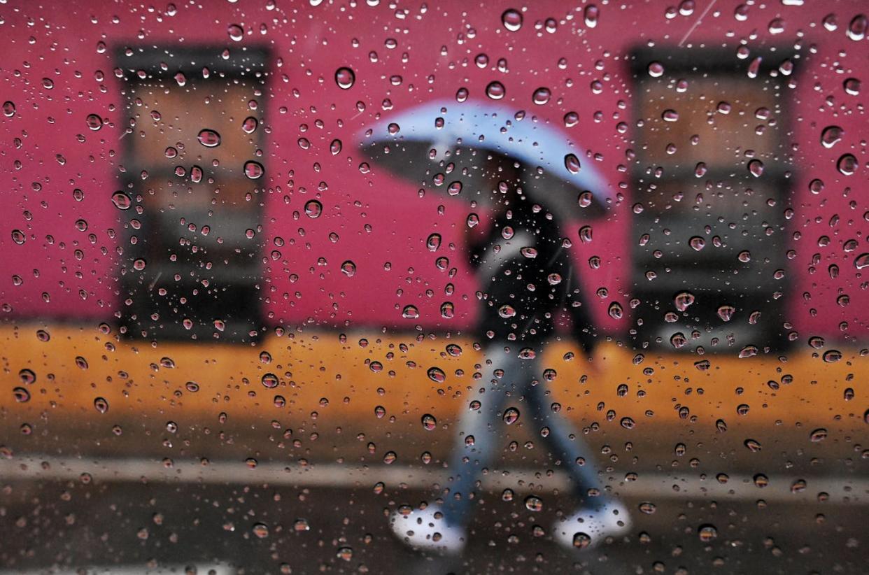La Niña typically means cooler, wetter conditions on average globally, but not everywhere, and not every time. <a href="https://www.gettyimages.com/detail/news-photo/man-walks-holding-an-umbrella-under-the-rain-in-cali-news-photo/1231647087" rel="nofollow noopener" target="_blank" data-ylk="slk:Luis Robayo/AFP via Getty Images;elm:context_link;itc:0;sec:content-canvas" class="link ">Luis Robayo/AFP via Getty Images</a>