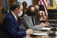 Japanese Prime Minister Yoshihide Suga speaks as he meets with Vice President Kamala Harris and Australian Prime Minister Scott Morrison, not pictured, in the Vice President's ceremonial office in the Eisenhower Executive Office Building on the White House campus, Friday, Sept. 24, 2021, in Washington. (AP Photo/Patrick Semansky, Pool)