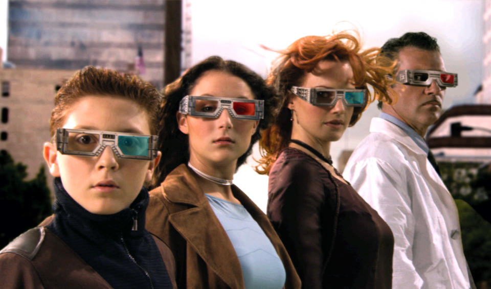 The Spy Kids family standing in line while wearing their high-tech spy glasses