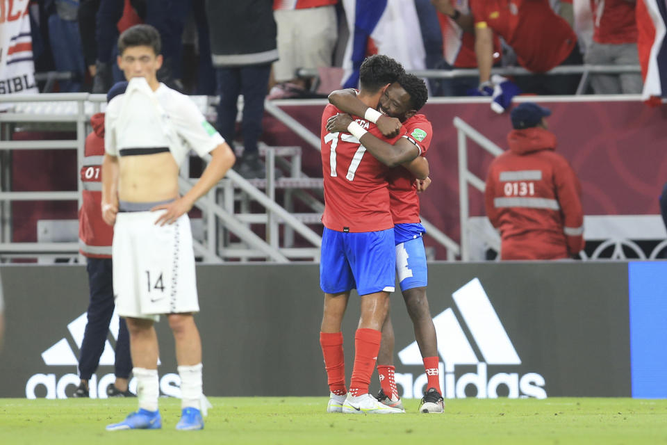 Costa Rica's players celebrate after the World Cup 2022 qualifying play-off soccer match between New Zealand and Costa Rica in Al Rayyan, Qatar, Tuesday, June 14, 2022. (AP Photo/Hussein Sayed)