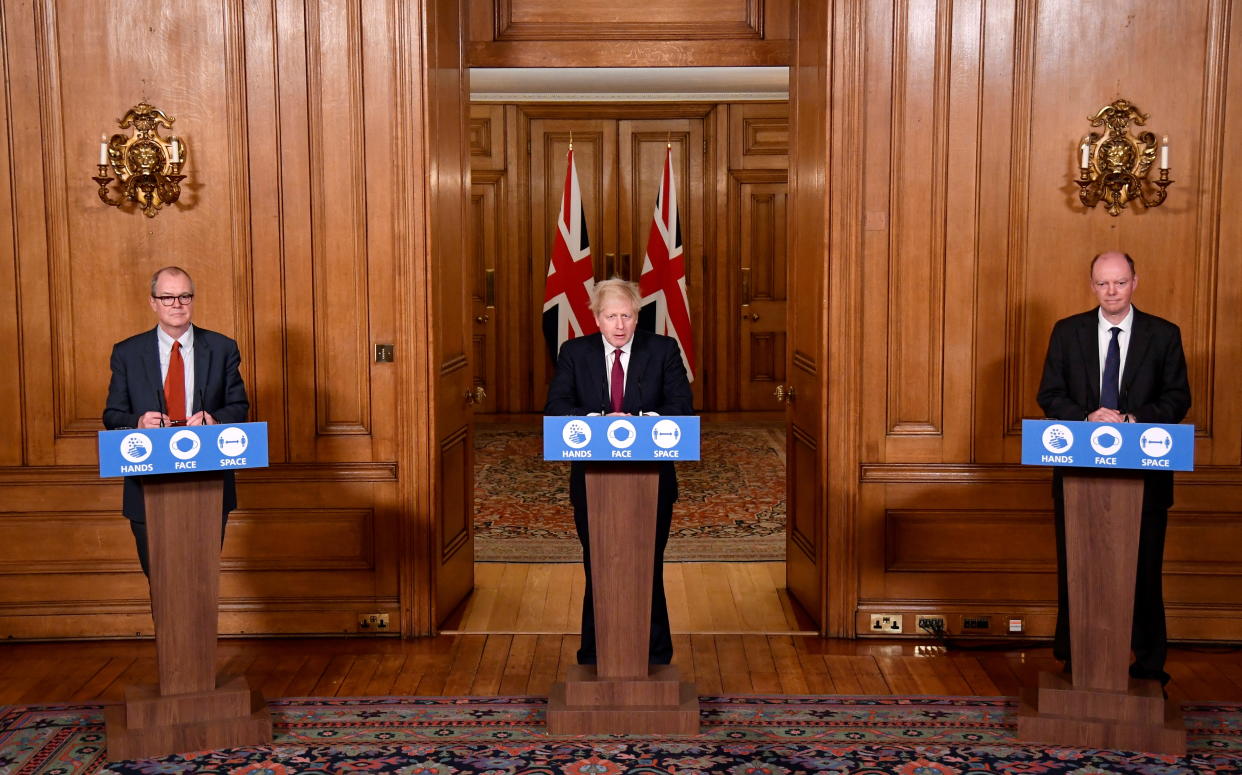 LONDON, ENGLAND - DECEMBER 19: Britain's Prime Minister Boris Johnson speaks during a news conference, flanked by Chris Whitty, the Chief Medical Officer for England and Sir Patrick Vallance, UK Government Chief Scientific Adviser, in response to the ongoing situation with the coronavirus disease (COVID-19) pandemic, inside 10 Downing Street on December 19, 2020 in London, England. The Prime Minister announces tier four restrictions for London and the South East. (Photo by Toby Melville - WPA Pool / Getty Images)