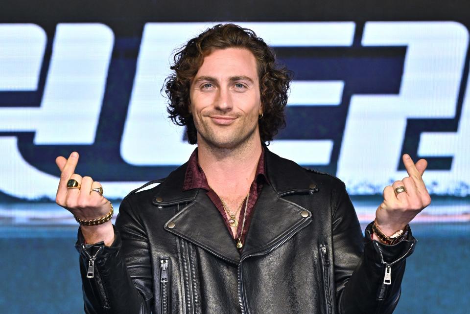 English actor Aaron Taylor-Johnson poses for a photo during a press conference to promote his film 