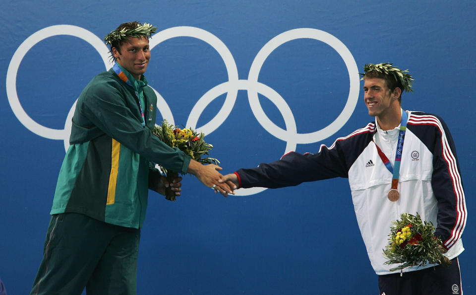 <b>Medal No. 3: </b>Bronze medalist Michael Phelps greets gold medalist Ian Thorpe of Australia as they stand on the podium during the medal ceremony for the men's 200m freestyle event on August 16, 2004 during the Athens 2004 Summer Olympic Games.