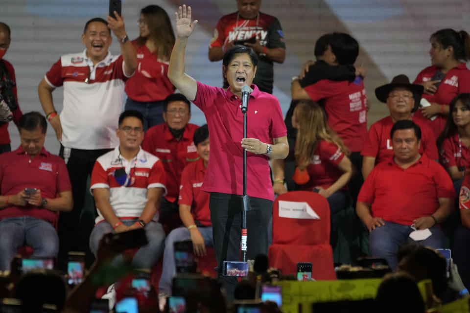 Presidential hopeful, former senator Ferdinand "Bongbong" Marcos Jr., the son of the late dictator, talks to the crowd during a campaign rally in Quezon City, Philippines on April 13, 2022. The winner of May 9, Monday's vote will inherit a sagging economy, poverty and deep divisions, as well as calls to prosecute outgoing leader Rodrigo Duterte for thousands of deaths as part of a crackdown on illegal drugs. (AP Photo/Aaron Favila)