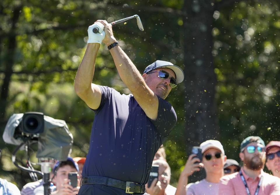 Phil Mickelson follows through on a tee shot on the second hole during the first round of the LIV Golf tournament, Friday, Sept. 2, 2022, in Bolton, Mass. (AP Photo/Mary Schwalm)