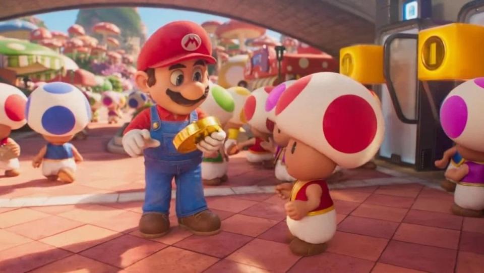 Mario has a coin and stands with Toad in Super Mario Bros movie which crossed one billion dollars at the box office