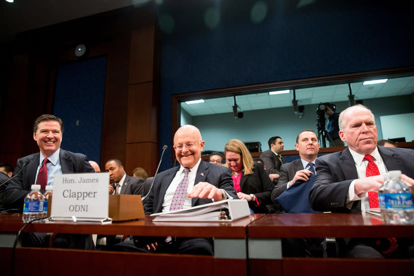 From left, FBI Director James Comey, Director of National Intelligence James Clapper, and CIA Director John Brennan arrive at a House Intelligence Committee hearing on worldwide threats Feb. 25, 2016.  