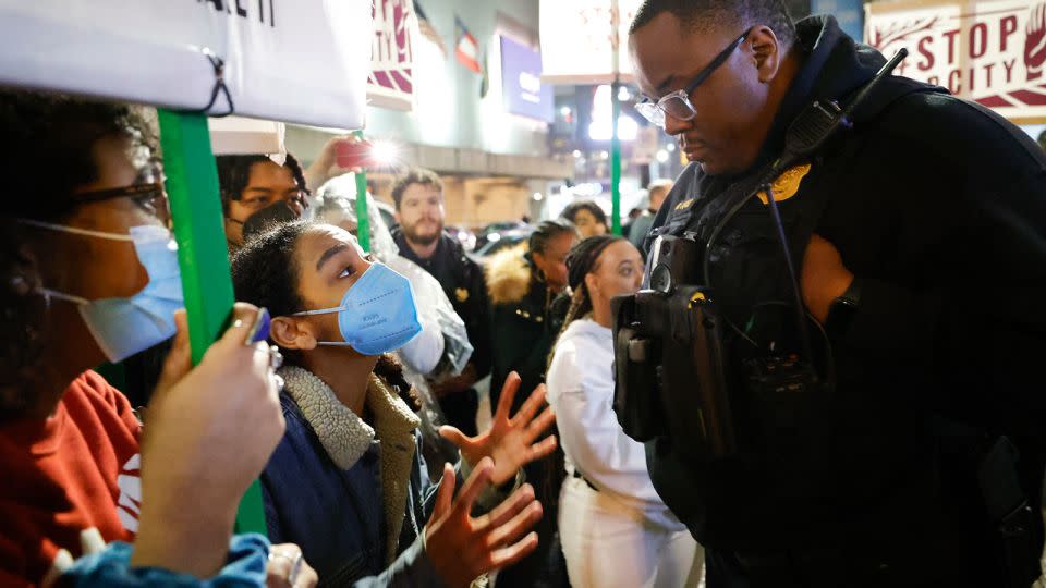 In this March 9, 2023 photo, demonstrators confront an Atlanta police officer during a protest over plans to build a new police training center, in Atlanta. Sixty-one people have been indicted in Georgia on racketeering charges following a long-running state investigation into protests against a proposed police and training facility in the Atlanta area that critics call “Cop City.” - Alex Slitz/AP
