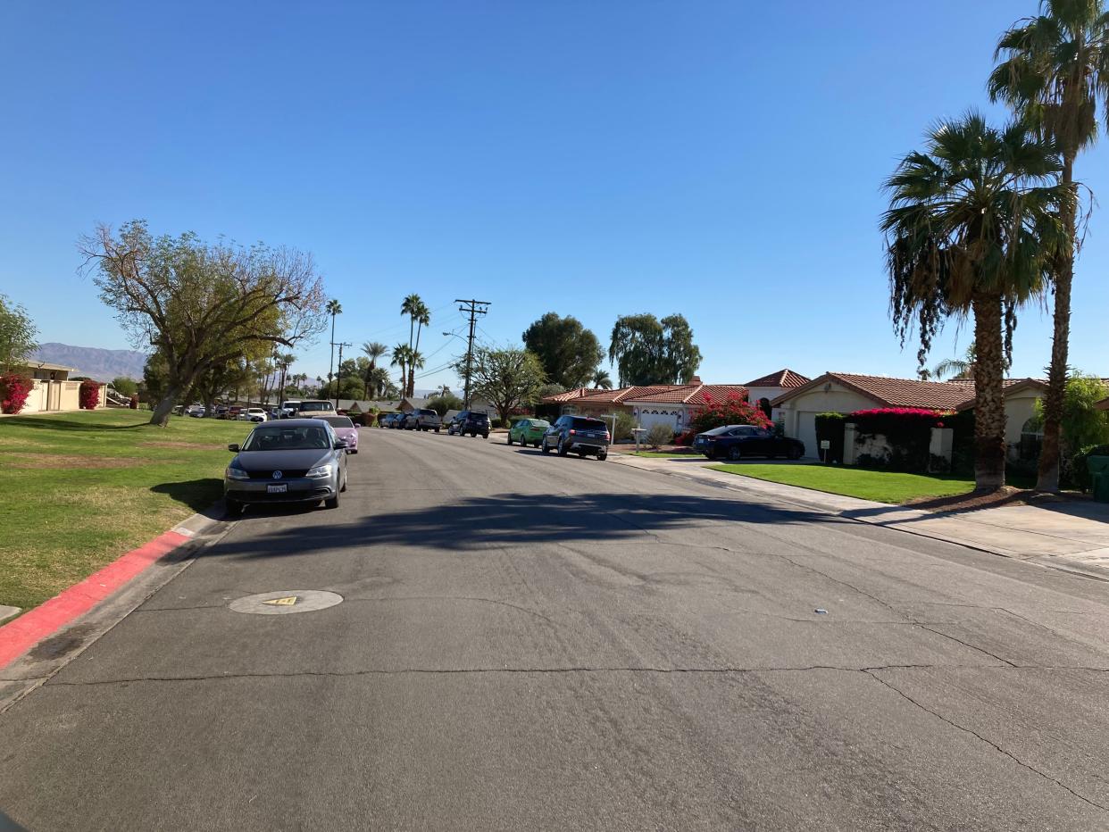 The view looking east down Michigan Drive on the block where a 93-year-old woman was found dead in her Palm Desert home on Tuesday, Nov. 30, 2021.