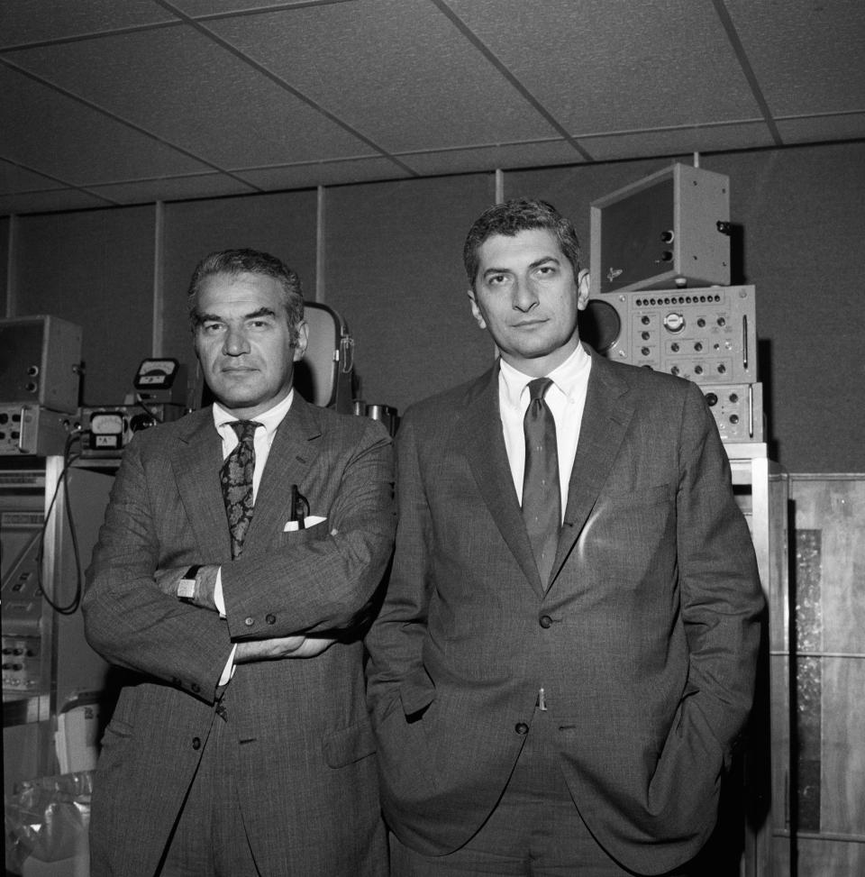 Portrait of American journalists and brothers Bernard Kalb (left) and Marvin Kalb as they pose before a wall of electronic equipment, November 5, 1969. / Credit: CBS News Archive / Getty Images