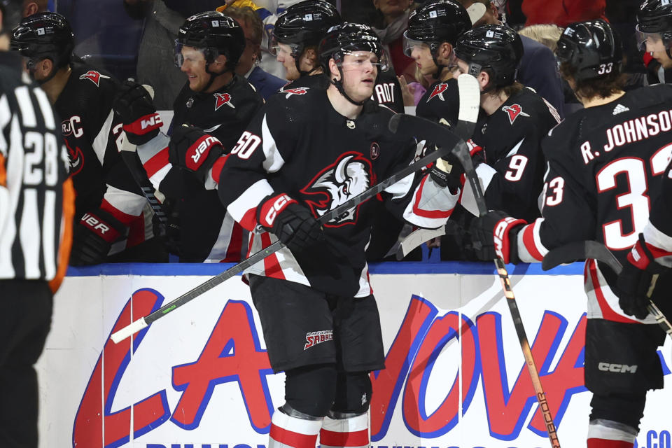 Buffalo Sabres left wing Eric Robinson (50) celebrates his goal during the second period of an NHL hockey game against the Winnipeg Jets Sunday, March 3, 2024, in Buffalo, N.Y. (AP Photo/Jeffrey T. Barnes)