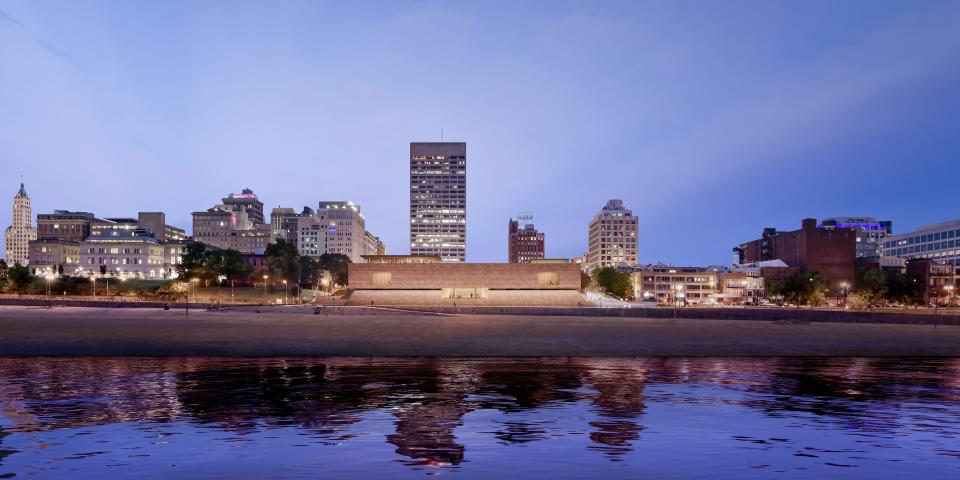 This rendering depicts the west side of the new Memphis Brooks Museum of Art, as it would be seen from the Mississippi River. (Unusual for an "urban" museum, the new Brooks will be visible from all four sides, and so has been designed to present what architects call an "iconic" view  from every angle.)