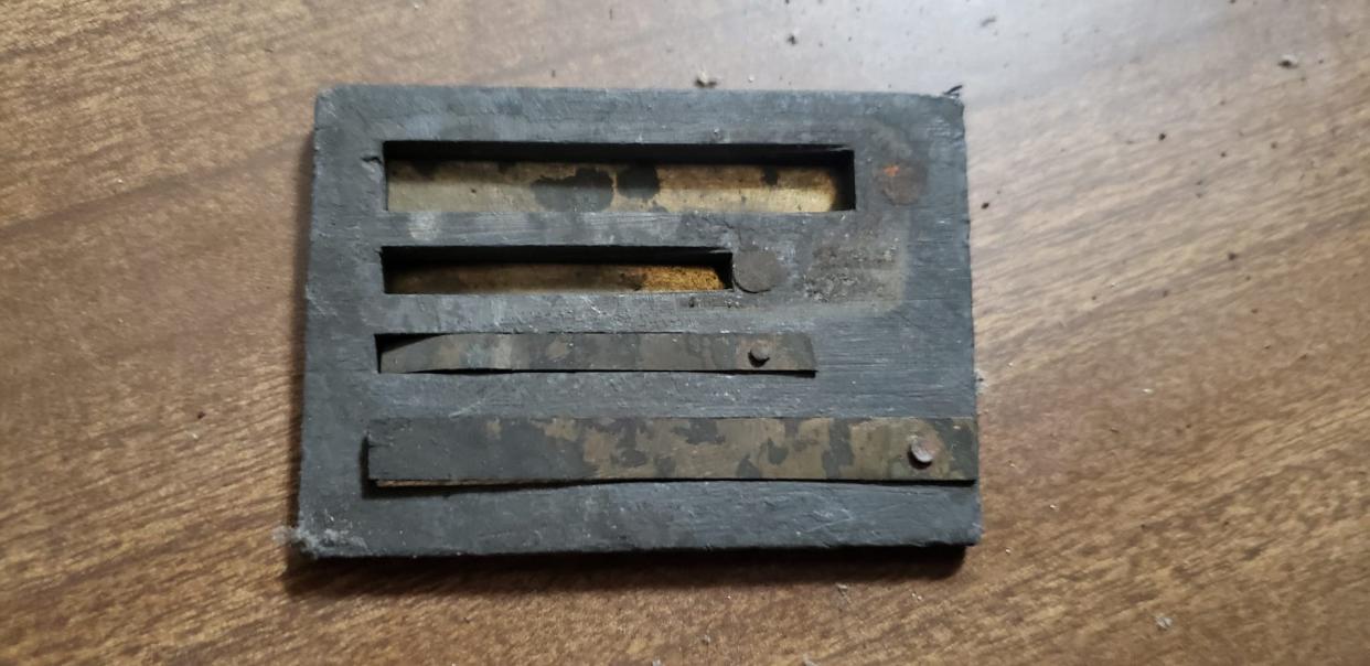 A metal piece found in a Michigan home in 2024. A member of the family who found it, Jesse Leitch, suspects it is part of a music box.
