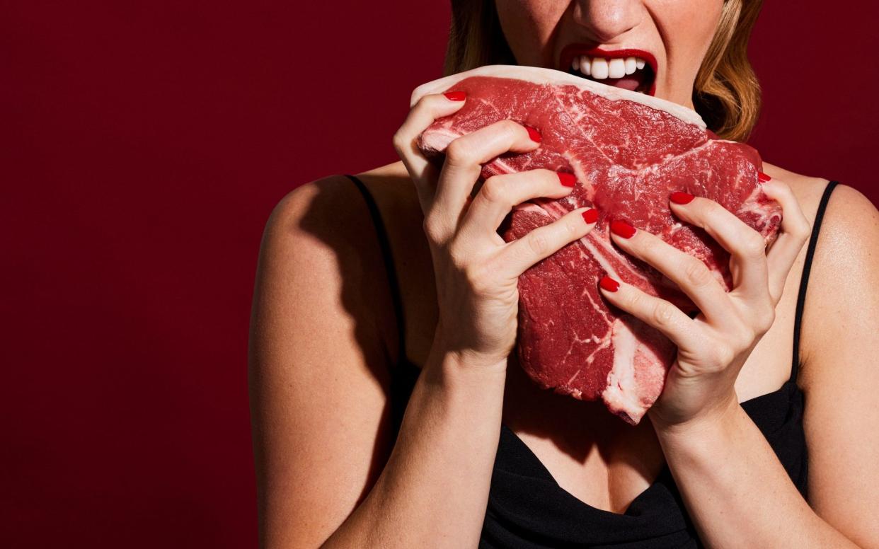 Woman eating meat