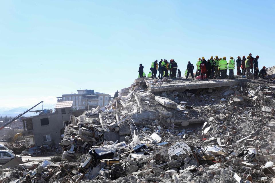 Rescuers and civilians look for survivors under the rubble of collapsed buildings in Nurdagi, in the countryside of Gaziantep, on February 9, 2023, three days after a deadly earthquake that hit Turkey and Syria.