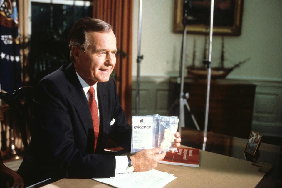 <div class="inline-image__caption"><p>President George H.W. Bush holds up a bag of crack cocaine seized by DEA agents during his first address to the nation from the Oval Office in 1989.</p></div> <div class="inline-image__credit">Mark Reinstein/Corbis via Getty Images</div>