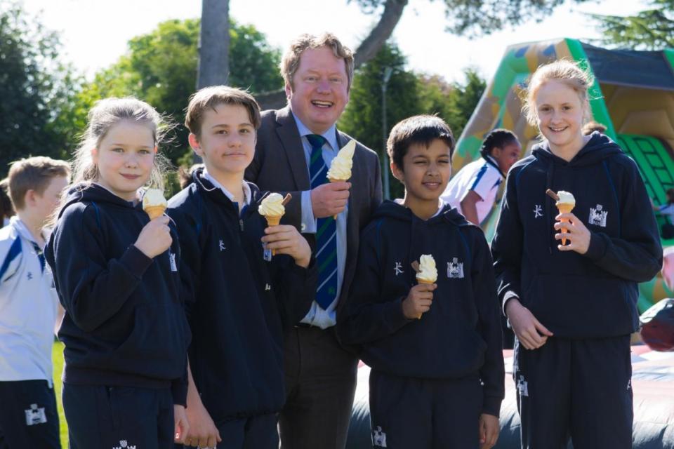 Shaun Fenton, head of Reigate Grammar School, eating ice-cream with pupils (Rich Turner)