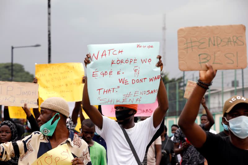 Nigerians take part in a protest against alleged violence, extortion and harassment from Nigeria's Special Anti-Robbery Squad (SARS), in Lagos