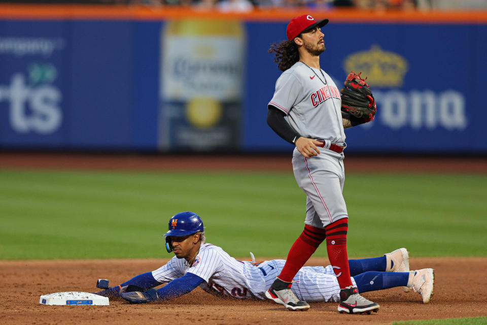 Aug 8, 2022; New York City, New York, USA;  New York Mets shortstop Francisco Lindor (12) steals second base behind Cincinnati Reds second baseman Jonathan India (6) during the third inning at Citi Field.
