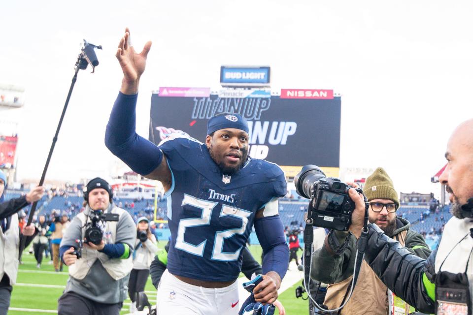 Tennessee Titans running back Derrick Henry (22) waves to the fans as he leaves the field against the Jacksonville Jaguars during the final game of the regular season on Jan. 7, 2024.