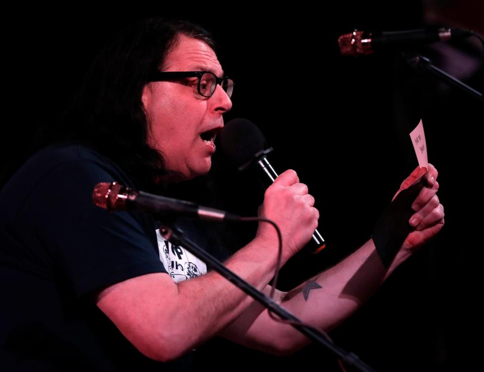 Tom Smith presents the award for Punk Artist of the Year during the Green Bay Area Music Awards on Thursday. The honor went to the Smart Shoppers.