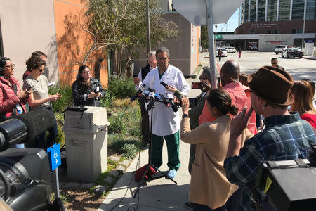 Trauma surgeon Andre Campbell speaks with reporters outside Zuckerberg San Francisco General Hospital and Trauma Center, where three victims were brought following the shooting. REUTERS/Heather Somerville