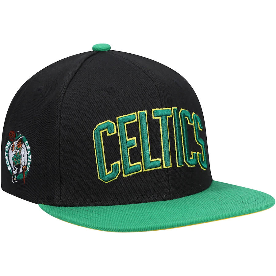 Black Celtics hat written in green with logo on the side.