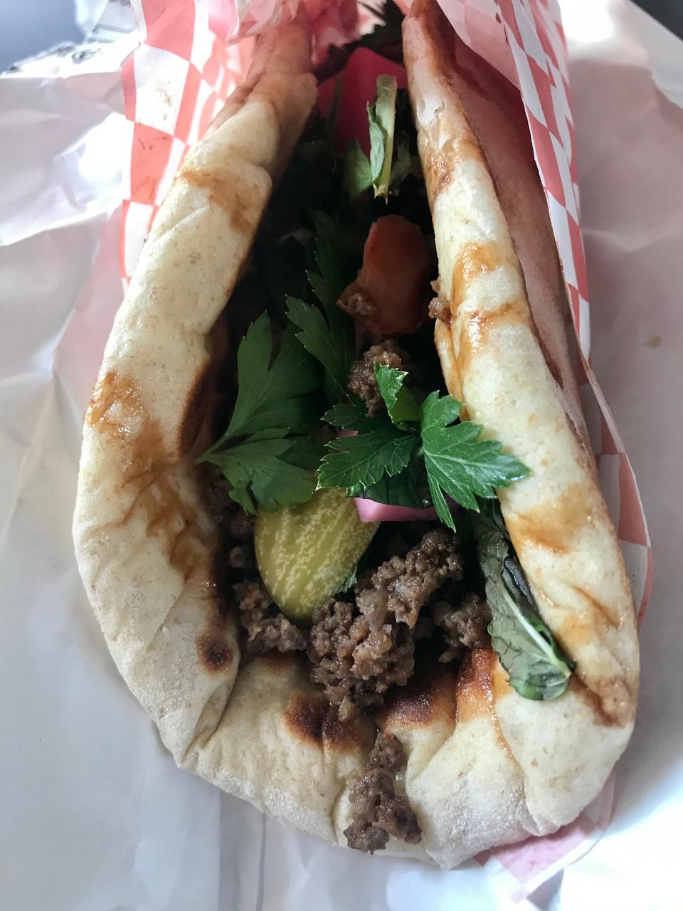 Middle East Side's spiced beef flatbread sandwich is made on the downtown pop-up's own bread.