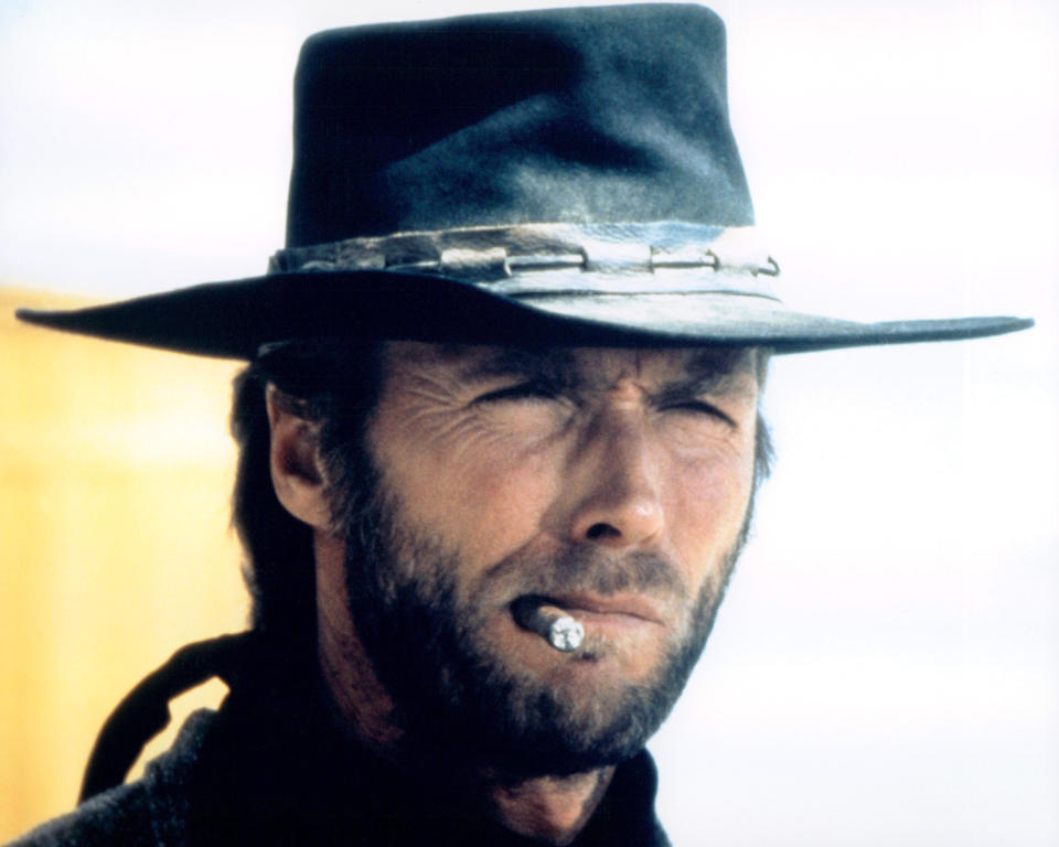 Headshot of Clint Eastwood, US actor, in costume, smoking a cigar in a publicity portrait issued for the film, 'High Plains Drifter', USA, 1973. The Western, directed by Clint Eastwood who also starred as 'The Stranger'. (Photo by Silver Screen Collection/Getty Images)