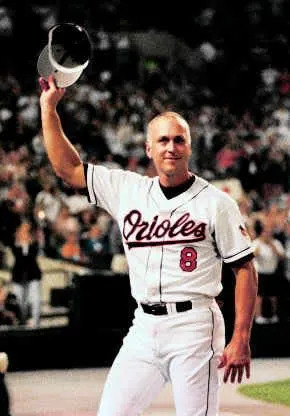 Cal Ripken Jr., tips his hat to the crowd at The Ballpark at Camden Yards in Baltimore after he took himself out of the starting lineup for Sunday night's game against the New York Yankees. It ended record 2,632 straight games started by Ripken. AP Photo