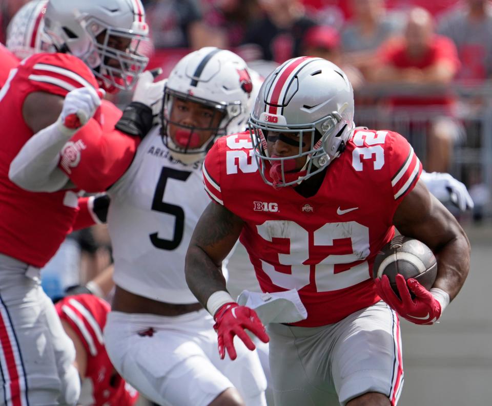 September 10, 2022; Columbus, Ohio, USA; Ohio State Buckeyes running back TreVeyon Henderson (32) carries the ball during the first half of Saturday's game against the Arkansas State Red Wolves at Ohio Stadium.Mandatory Credit: Barbara J. Perenic/Columbus Dispatch