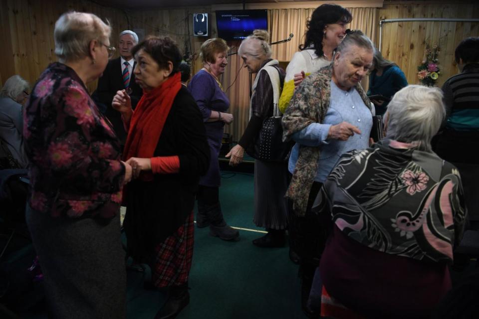 Jehovah’s Witnesses gather in a house in the village of Vorokhobino, north of Moscow, where they meet for services (James Hill/New York Times)
