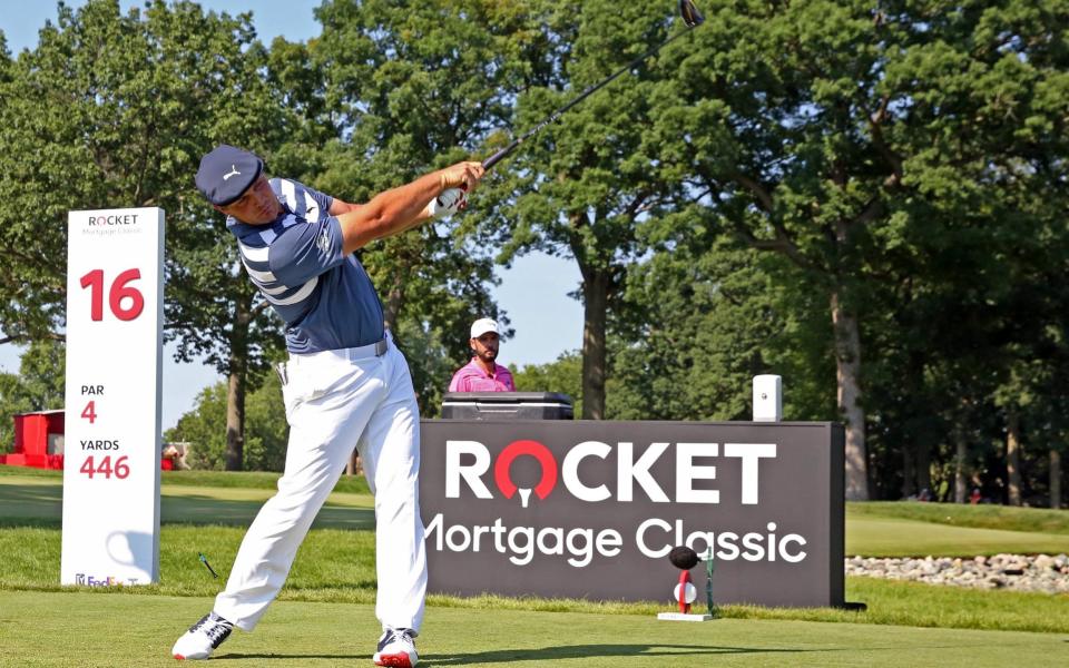 Bryson DeChambeau hits his tee shot on the 16th hole during the Rocket Mortgage Classic golf tournament - USA Today
