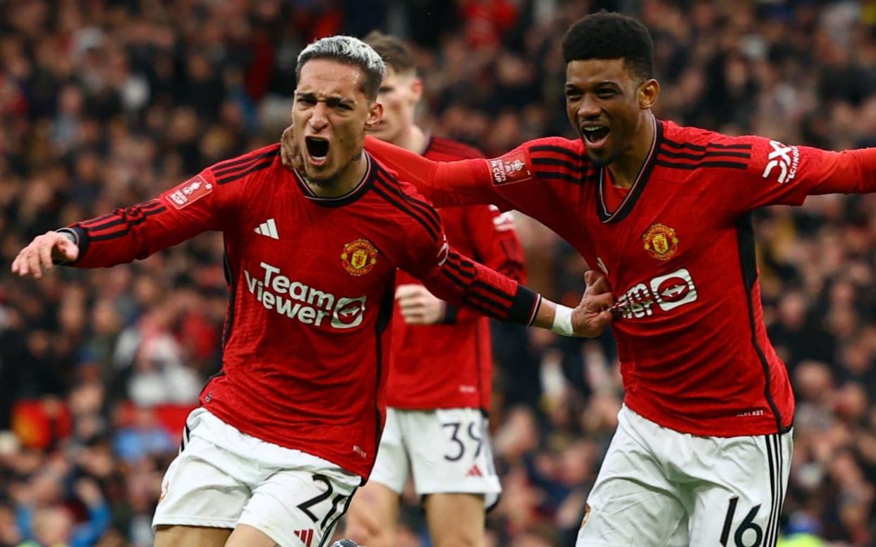 Manchester United's Antony celebrates scoring their second goal with Amad Diallo