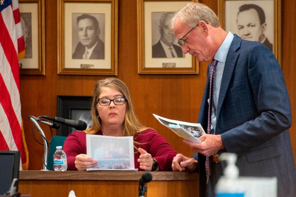 Jennifer Foster answers questions about photos of her and Ryan Brashear on the witness stand during a trial at the Harrison County Courthouse in Biloxi on Tuesday, March 28, 2023.