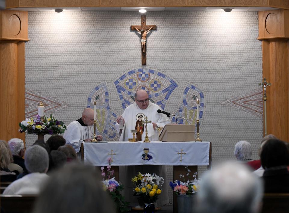 The Rev. Nicholas Mancini celebrates the birthday of Mother Angelica with a Mass and dedication ceremony for a new monument at the St. Raphael Center in Jackson Township.