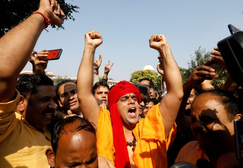 Chakrapani Maharaj, President of All India Hindu Mahasabha, reacts as he celebrates after Supreme Court's verdict on a disputed religious site, outside the court in New Delhi