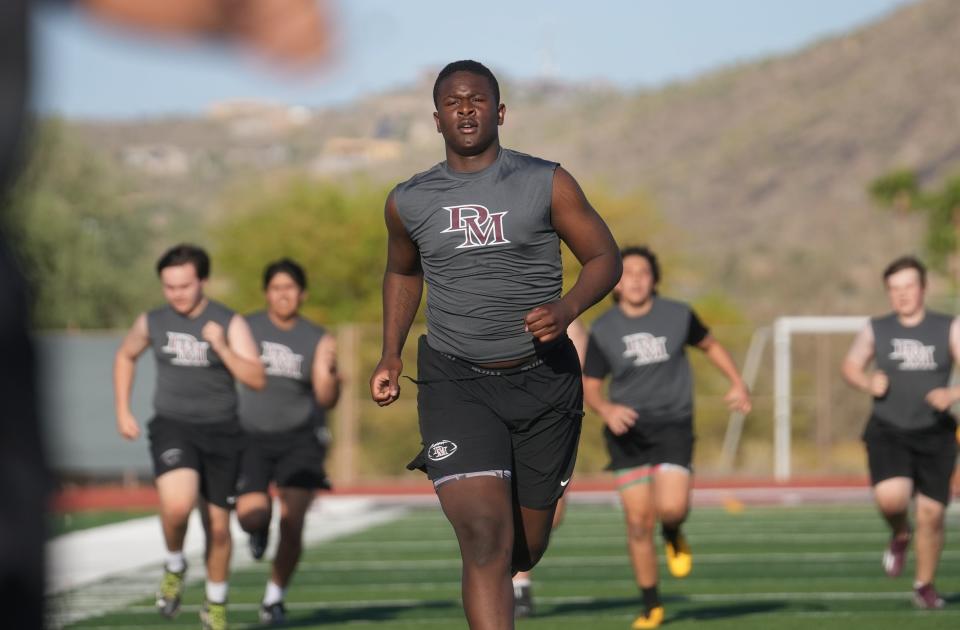 Tony Cumberland practices with his teammates at the Desert Mountain High football field in Scottsdale on May 3, 2023.