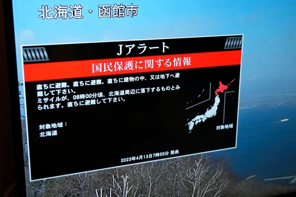 A TV shows J-Alert or National Early Warning System to the Japanese residents Thursday, 13 April 2023 in Yokohama, south of Tokyo (AP)