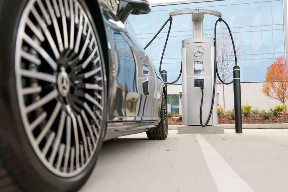 A Mercedes-Benz car is seen pulling into the new EV charging station outside Mercedes-Benz headquarters on November 15, 2023 in Atlanta.  Mercedes-Benz introduced a groundbreaking fast-charging hub for electric vehicles (EV) at its US headquarters, launching a plan to deploy 2,000 charging stations worldwide by the end of 2024.  (Miguel Martinez/The Atlanta Journal-Constitution/TNS)