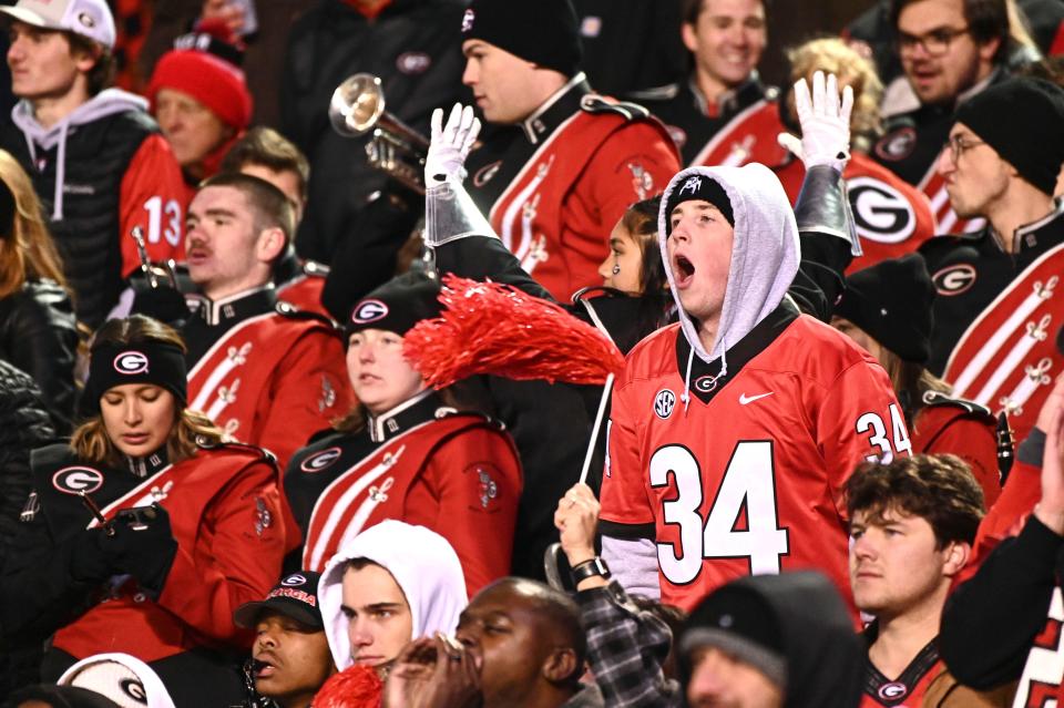Georgia Bulldogs fans cheer during the fourth quarter of a game against the Mississippi State Bulldogs at Davis Wade Stadium at Scott Field.
