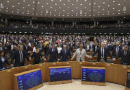 MEP's sing and hold hands after a vote on the UK's withdrawal from the EU, the final legislative step in the Brexit proceedings, during the plenary session at the European Parliament in Brussels, Wednesday, Jan. 29, 2020. The U.K. is due to leave the EU on Friday, Jan. 31, 2020, the first nation in the bloc to do so. (Yves Herman, Pool Photo via AP)