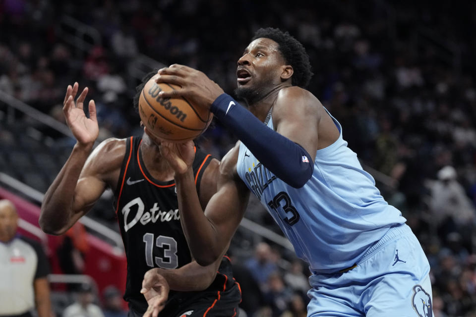 Memphis Grizzlies forward Jaren Jackson Jr. (13) is defended by Detroit Pistons center James Wiseman (13) during the first half of an NBA basketball game, Monday, April 1, 2024, in Detroit. (AP Photo/Carlos Osorio)