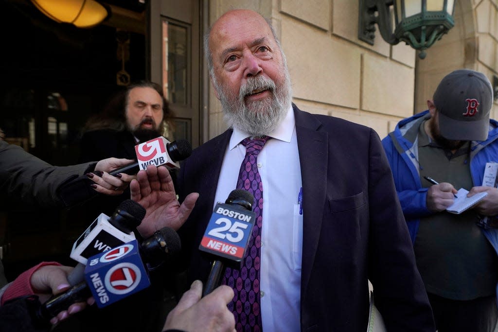 John Amabile, center, an attorney for Junmyung Lee, departs the federal courthouse in downtown Worcester.