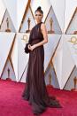 <p>Zendaya opts for a grecian-style brown one-sleeve gown designed by Giambattista Valli Haute Couture. She brought serious sophistication to the carpet.</p>