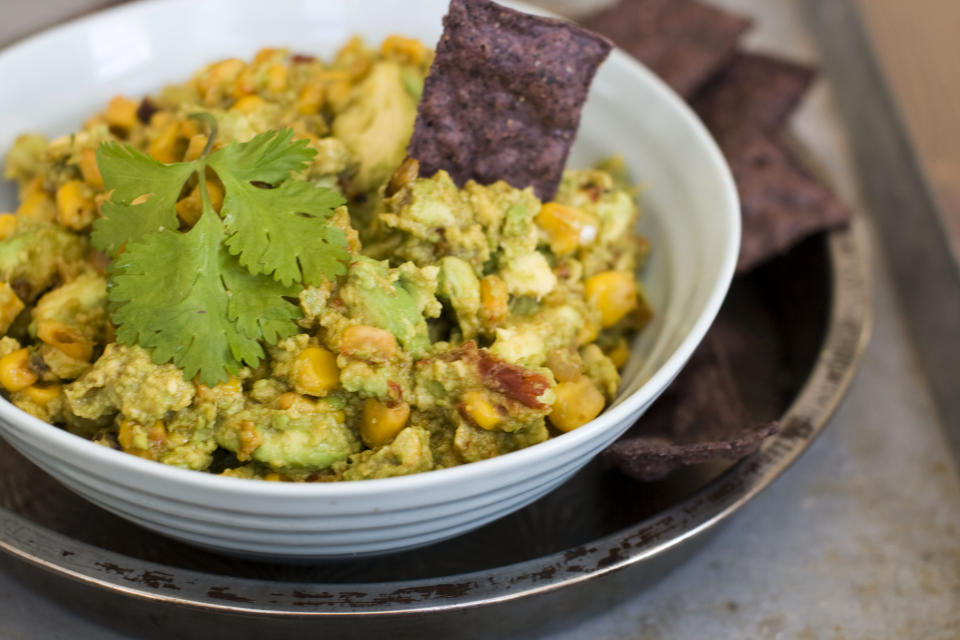 In this image taken on January 7, 2013, chipotle corn guacamole is shown served in a bowl in Concord, N.H. (AP Photo/Matthew Mead)