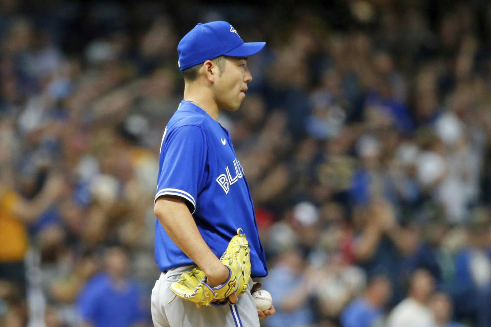 Toronto Blue Jays starting pitcher Yusei Kikuchi reacts after giving up a solo home run to Milwaukee Brewers' Mike Brosseau during the third inning of a baseball game Saturday, June 25, 2022, in Milwaukee. (AP Photo/Jon Durr)